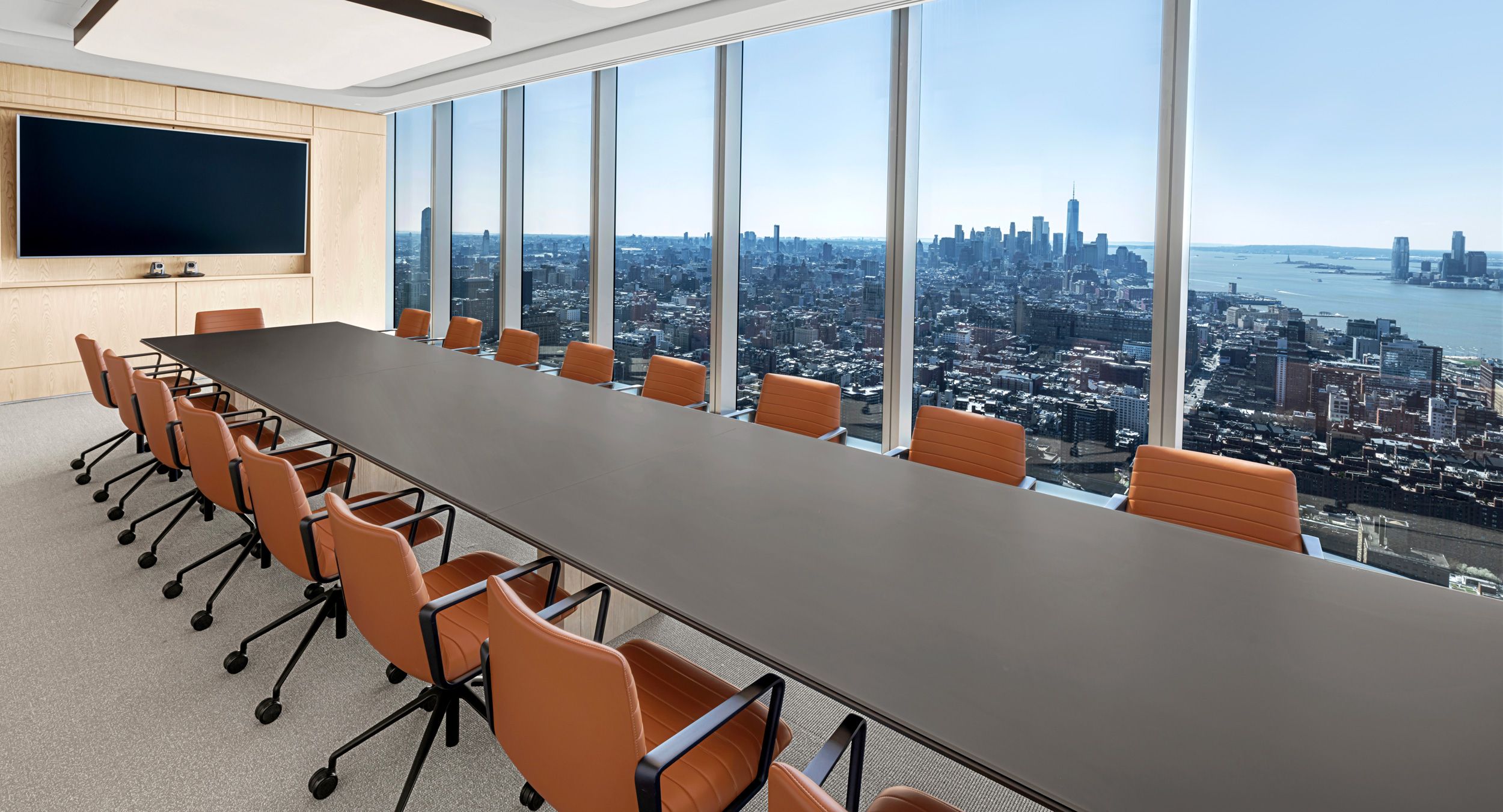 54d x 288w HALO conference table with a back-painted etched glass surface, Mink HALO soft edge, and flat cut Sen panel base.